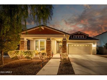 Charming home with festive lights and landscaping at 14859 W Surrey Dr, Surprise, AZ 85379