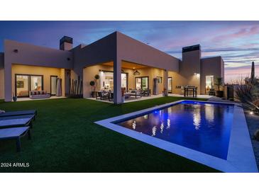 Luxury backyard oasis with a sparkling pool and spacious patio at 8300 E Dixileta Dr # 279, Scottsdale, AZ 85266