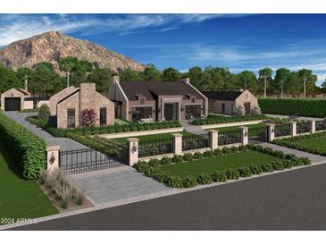 Stunning stone house with a large yard, gated entrance, and mountain views at 4864 E Lafayette Blvd, Phoenix, AZ 85018