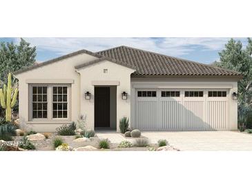 One-story home with tile roof, two-car garage, and desert landscaping at 1936 W Rowel Rd, Phoenix, AZ 85085