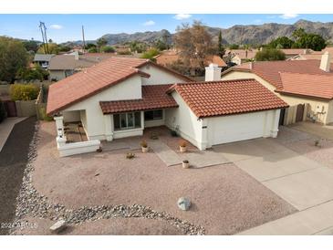 Single story home with desert landscaping and two-car garage at 12810 S 41St St, Phoenix, AZ 85044