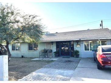 Ranch style home with a spacious yard and wrought iron entry gate at 2310 N 40Th Dr, Phoenix, AZ 85009