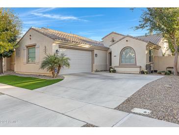 Single-story home with a two-car garage, landscaping, and a neutral color palette at 4741 E Timberline Rd, Gilbert, AZ 85297