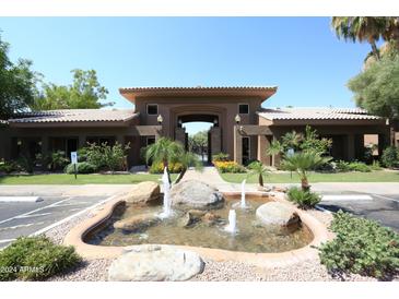 Attractive community entrance with fountain and landscaping at 7009 E Acoma Dr # 1105, Scottsdale, AZ 85254