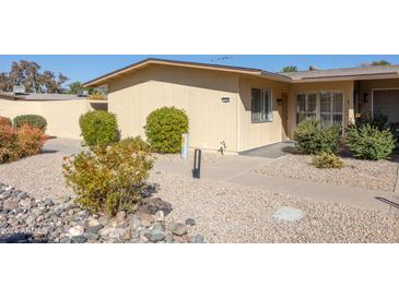 Inviting exterior with landscaped walkway and desert landscaping at 13324 W Stonebrook Dr, Sun City West, AZ 85375