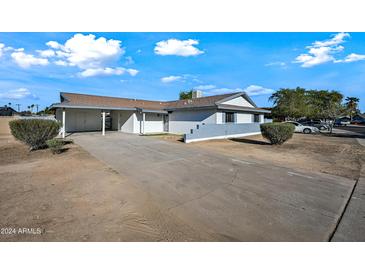 Updated single-level home with carport and well-maintained landscaping at 6526 W Devonshire Ave, Phoenix, AZ 85033