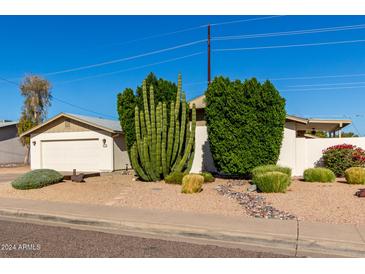House exterior showcasing drought-tolerant landscaping and a clean design at 6816 E Oak St, Scottsdale, AZ 85257