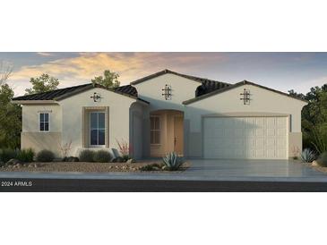Single-story home with Spanish-style architecture, two-car garage, and desert landscaping at 17762 W Windsor Blvd, Avondale, AZ 85392