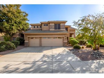 Two-story house with a three-car garage and well-maintained landscaping at 2813 E Indian Wells Pl, Chandler, AZ 85249