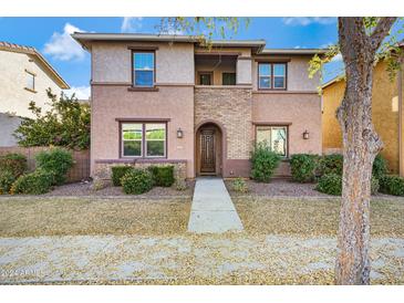 Two-story home with stone accents and landscaping at 3836 E Gideon Way, Gilbert, AZ 85296