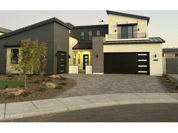 Modern two-story home with dark gray and white exterior, two-car garage, and landscaped front yard at 9872 W Black Hill Rd, Peoria, AZ 85383