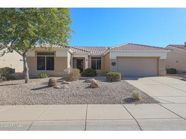 One-story house with a two-car garage and desert landscaping at 22405 N 148Th Ave, Sun City West, AZ 85375