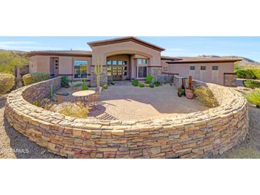 Stunning desert home with circular driveway and landscaped courtyard at 24686 N 120Th Pl, Scottsdale, AZ 85255