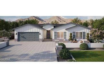 Modern farmhouse exterior with gray garage door and landscaped yard at 927 N 97Th Way, Mesa, AZ 85207