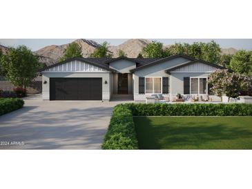 Craftsman style home with a two-car garage and landscaped yard at 943 N 97Th Way, Mesa, AZ 85207