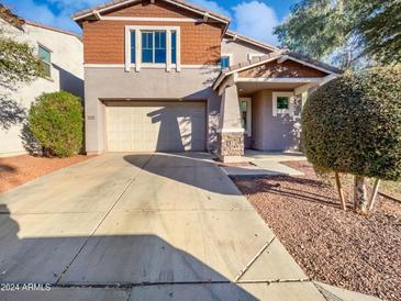 Two-story house with attached garage and landscaping at 12010 W Polk St, Avondale, AZ 85323