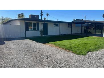 Newly remodeled home with fresh landscaping and gravel driveway at 3937 W Cypress St, Phoenix, AZ 85009