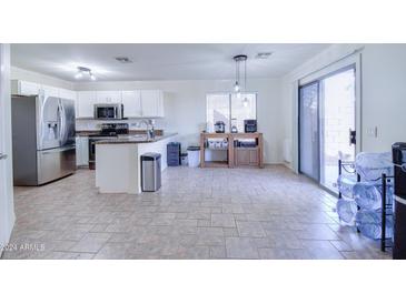 Modern kitchen with stainless steel appliances and granite countertops at 10856 E Arcadia Ave, Mesa, AZ 85208