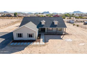 Aerial view of a charming house with mountain views at 527 W Silverdale Rd, San Tan Valley, AZ 85143