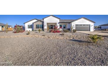 Stunning modern farmhouse exterior with landscaped front yard at 4072 E Weston Ln, San Tan Valley, AZ 85140