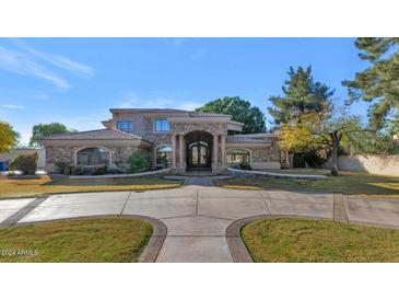 Luxury home with stone accents and a circular driveway at 2181 E La Vieve Ln, Tempe, AZ 85284