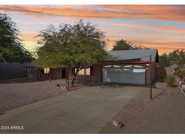 Single story home with a carport and nicely landscaped front yard at 1022 W Calle Tuberia --, Casa Grande, AZ 85194