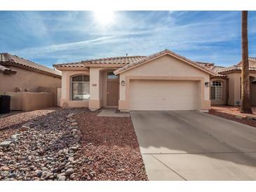 Single-story home with a two-car garage and desert landscaping at 5191 W Shannon St, Chandler, AZ 85226