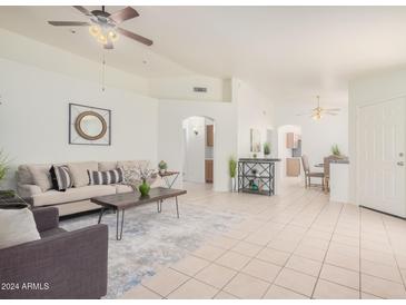 Open living area with neutral decor and view into dining area at 1710 W Orchid Ln, Chandler, AZ 85224