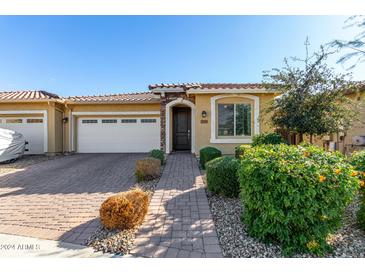 Single-story home with attached garage and landscaped front yard at 24589 N 172Nd Dr, Surprise, AZ 85387