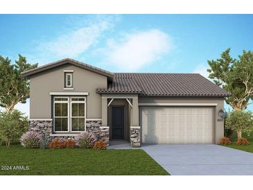 Single-story home with neutral exterior, two-car garage, and landscaping at 32962 N 131St Dr, Peoria, AZ 85383