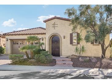 Single-story home with stucco exterior, tile roof, and landscaped front yard at 12671 W Dale Ln, Peoria, AZ 85383