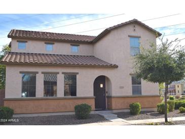 Two-story house with Spanish-style tile roof and landscaping at 7229 S 48Th Ln, Laveen, AZ 85339