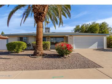 Ranch-style home with a carport and well-manicured landscaping at 333 N 58Th St, Mesa, AZ 85205