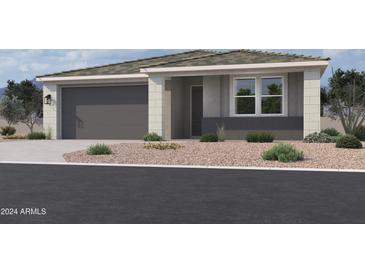 Single-story home with a two-car garage and desert landscaping at 7585 W Smoketree Dr, Peoria, AZ 85383