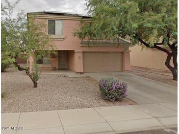 Two-story house with a two-car garage and desert landscaping at 3630 N French Pl, Casa Grande, AZ 85122