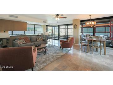 Open living area with hardwood floors, modern furniture, and city views at 4808 N 24Th St # 621, Phoenix, AZ 85016