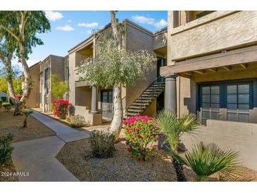 Attractive exterior of a condo building with landscaping and walkway at 5995 N 78Th St # 2050, Scottsdale, AZ 85250