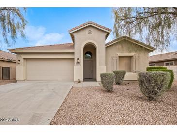 Charming single-story home with a two-car garage and desert landscaping at 2494 E Dulcinea Trl, Casa Grande, AZ 85194