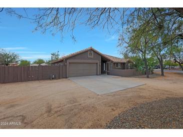 Single-story home with attached garage and desert landscaping at 501 E Desert Hills Estate Dr, Phoenix, AZ 85086