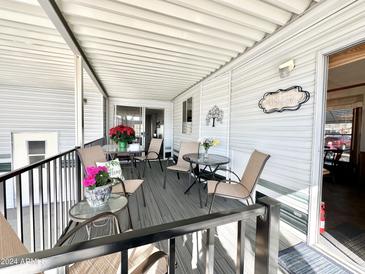 Spacious deck with outdoor furniture, railing, and a 