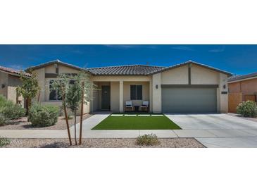 Beautiful single-story home with a two-car garage and attractive landscaping at 23123 E Via Del Sol --, Queen Creek, AZ 85142