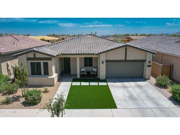 Inviting single-story home with a two-car garage and a well-maintained front yard at 23123 E Via Del Sol --, Queen Creek, AZ 85142