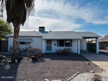 Charming single-story home with a covered carport and desert landscaping at 2341 E Betty Elyse Ln, Phoenix, AZ 85022