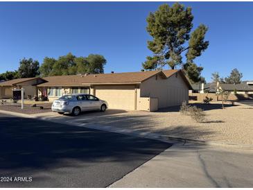 One-story home with attached two-car garage and gravel landscaping at 11616 S Jokake St, Phoenix, AZ 85044