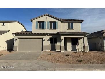 Two-story home with a two-car garage and a landscaped front yard at 31491 N Wet Creek Rd, San Tan Valley, AZ 85143