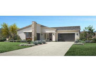 Exterior elevation of a modern single-story home with a two-car garage and landscaped front yard at 35244 N Barley St, San Tan Valley, AZ 85144