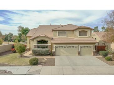 Inviting two-story home with a landscaped front yard and attached two-car garage at 912 N 164Th Dr, Goodyear, AZ 85338