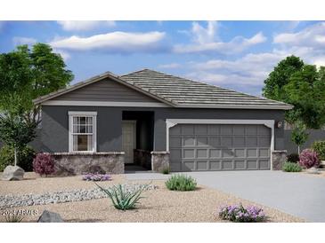 Charming single-story home with a gray exterior, stone accents, and a two-car garage at 20019 W Badgett Ln, Litchfield Park, AZ 85340