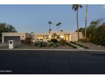 Stunning desert contemporary home with landscaped front yard and walkway at 9919 N 47Th Pl, Phoenix, AZ 85028