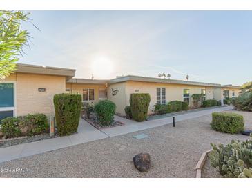 Welcoming single-story home with a well-maintained front yard and inviting entrance at 14015 N 111Th Ave, Sun City, AZ 85351